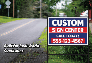 Real estate yard sign installed along a roadside, designed to remain clear and readable in real-world outdoor conditions.
