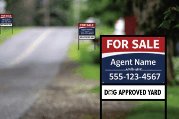 Real estate yard sign placed along a residential road demonstrating visibility, layout, and readable design