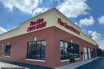 Commercial storefront with bold channel letter signage reading “Fine Line Auto Body” on a corner building, demonstrating effective small business marketing through signage.