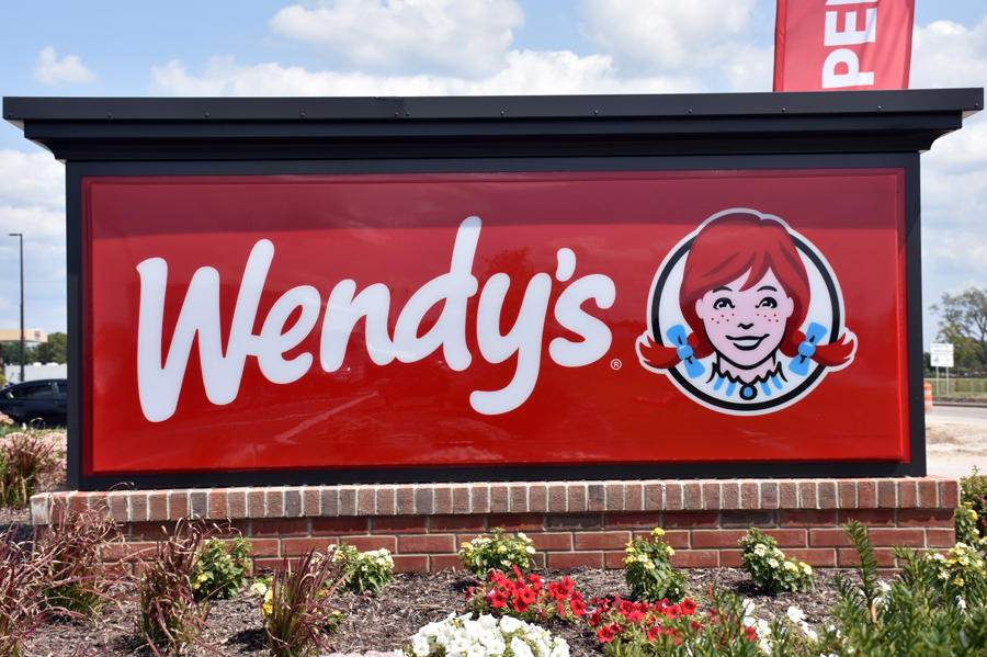 Finished Wendy’s monument sign installed with brick base and illuminated cabinet