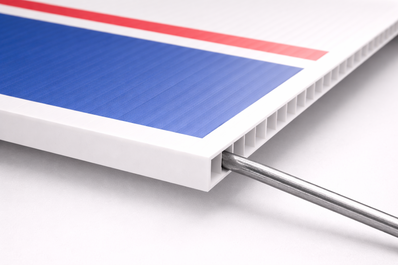 Close-up of corrugated plastic yard sign with galvanized wire inserted into internal flute